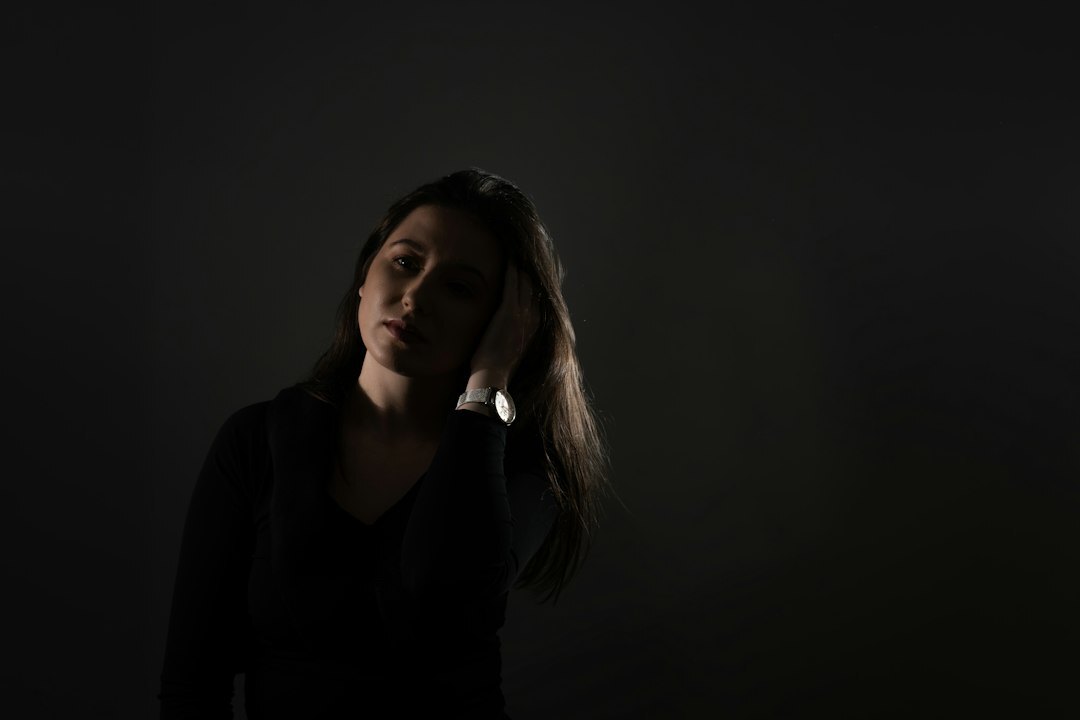woman silhouette disappearing in dark