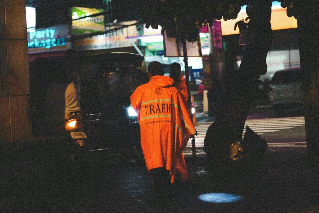 detective in raincoat at night